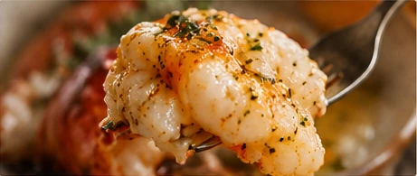 A fork lifting a tender piece of lobster